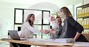 Partner manager shakes hands with employee as sign of good deal