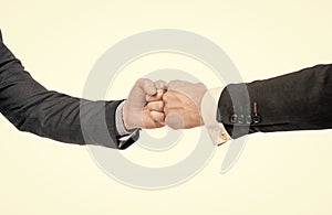 partner relationship. male friendship. businessmeeting. two pumping fist. business deal.