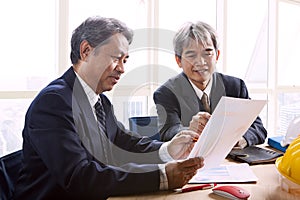 Partner of senior engineering working man serious meeting about