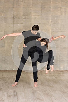 Partnering dance on grey background.