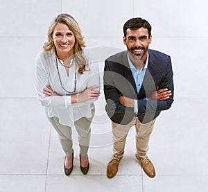 Partnering up to deliver outstanding results. Portrait of two businesspeople standing together in an office.