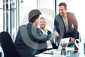 Partnering up to expand the business. businesspeople having a meeting in a boardroom.