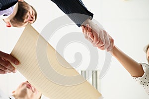 Partners shake hands over business agreement, successful deal between biz partners