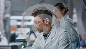 Partners working science laboratory looking computer closeup. Smiling researcher