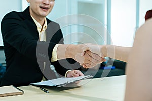 Partnership. business people partner shaking hand after business signing contract desk in meeting room at company office, job inte