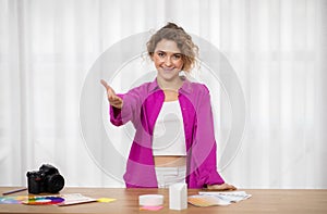 Partnership Concept. Smiling Female Photographer Extending Hand For Handshake At Camera