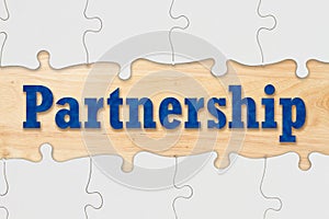 Partnership and teamwork concept coming together with puzzle pieces