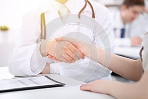 Partnership, trust og doctor and patient, medical ethics concept. Handshake in medicine