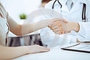 Partnership, trust og doctor and patient, medical ethics concept. Handshake in medicine