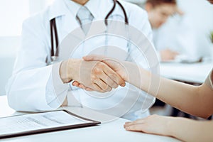 Partnership, trust og doctor and patient, medical ethics concept. Handshake in medicine