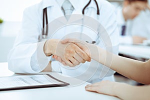 Partnership, trust og doctor and patient, medical ethics concept. Handshake in medicine