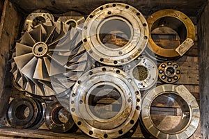 Parts of a centrifugal compressor in a wooden box