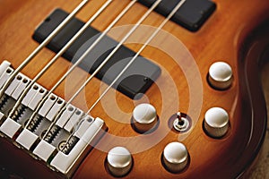 Parts of Electric guitar. Close up view of electric guitar body with volume and tone control knobs
