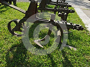 Parts of a large agricultural cultivator