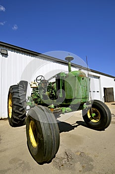 Parts of an old tractor missing under the hood