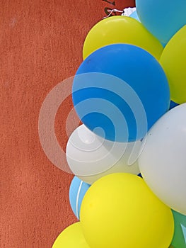 Party balloons in blue, white and yellow. Celebrating a birthday or wedding.