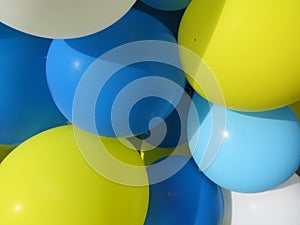 Party balloons in blue, white and yellow. Celebrating a birthday or wedding.