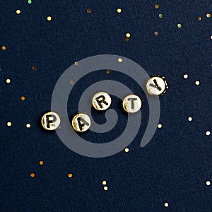 PARTY beads text typography on dark blue