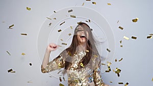Party Celebration. Happy Woman Throwing Gold Confetti, Dancing