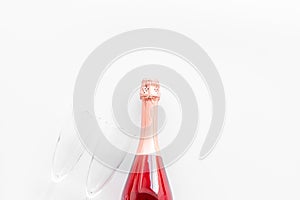 Party with champagne bottle and glasses on white background top view copyspace