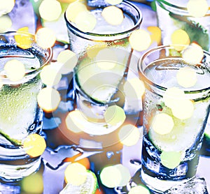 A party in the club. Cocktails on the bar. Alcohol. Vodka, gin, tequila with ice and lime. Alcoholic cocktail cocktail. Selective