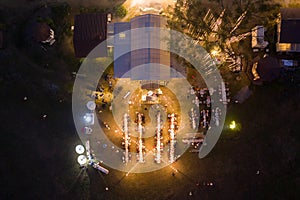 The party with dining table and people in wedding celebration with light glowing at night