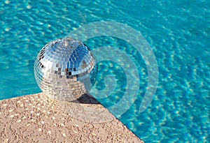 Party! Disco Ball beside resort swimming pool