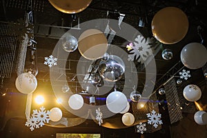 Party disco decorations with lights and christmass balls on the ceiling