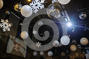 Party disco decorations with lights and christmass balls on the ceiling