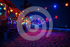 party and drink at the summer beach night. blue and red colors. neon and flashlights