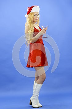Party, drinks, christmas, x-mas concept - smiling woman in red d