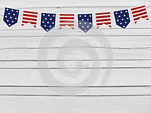 Party flags on wooden background. 4th July, Independence day, card, invitation in usa flag colors. Top view, empty space.