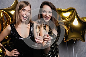 Party Fun. Beautiful Girls Celebrating New Year. Portrait Of Gorgeous Smiling Young Women Enjoying Party Celebration