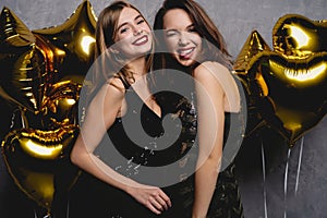 Party Fun. Beautiful Girls Celebrating New Year. Portrait Of Gorgeous Smiling Young Women Enjoying Party Celebration