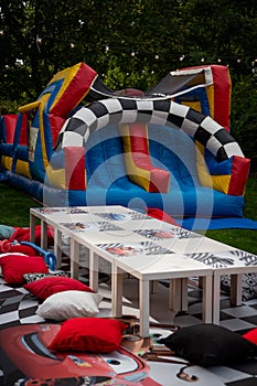 Party in the garden. Balloon Arrangement. Festive table setting. Games.