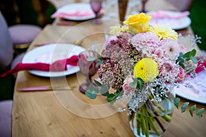 Party in the garden. Flowers Arrangement. Festive table setting. Party with a special theme.