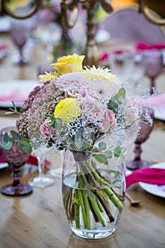 Party in the garden. Flowers, glasses and Balloons Arrangement. Festive table setting. Party with a special theme.