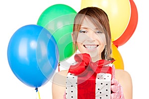 Party girl with balloons and gift box