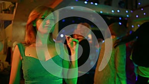 Party, holidays, celebration, nightlife and people concept - girl dancing in the club