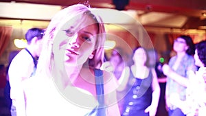 Party, holidays, celebration, nightlife and people concept - girl dancing in the club