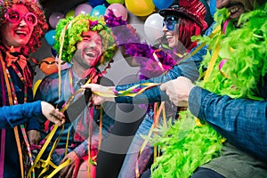 Party People celebrating carnival or New Year in party club