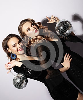 Party and people concept: Party girls with disco balls