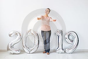 Party, people and new year holidays concept - woman celebrating new years eve 2019 with and sparklers