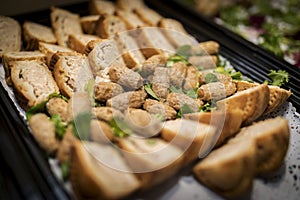 Party sausages and pork pies finger food at a wedding buffet in