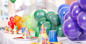 Party table with latex baloons in different colours