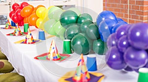 Party table with latex baloons in different colours