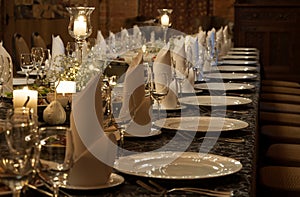 Party table setting lit by candles