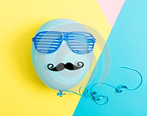 Party theme with balloon, moustache and shutter shades