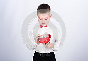 Party time. Businessman. Formal wear. happy child with retro clock in bow tie. little boy with alarm clock. Time to