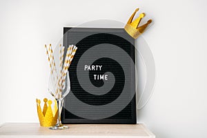 Party time fun celebration event minimal concept with blackboard with text Party time on white. Party supplies, banners